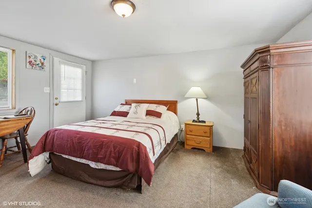 a bedroom with bed and a couch