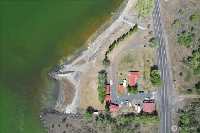 a view of a patio with table and chairs and potted plants