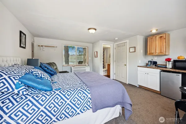 a bed room with a bed and furniture