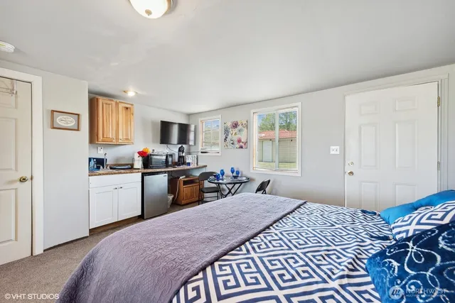 a bedroom with a bed and a window