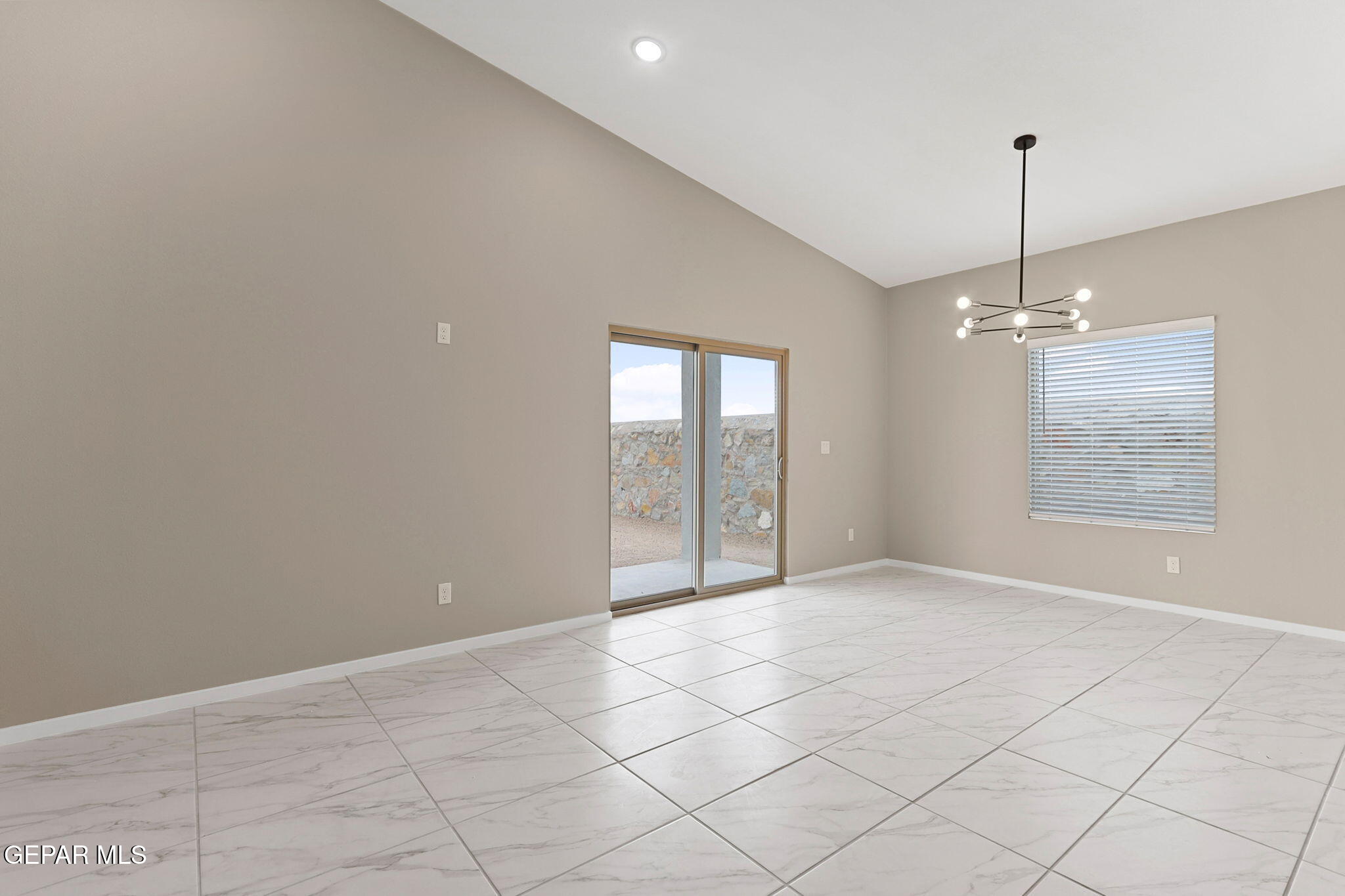 609 Espa Court Vinton, TX 79821 - Photo 12 of 19 a view of an empty room with a window