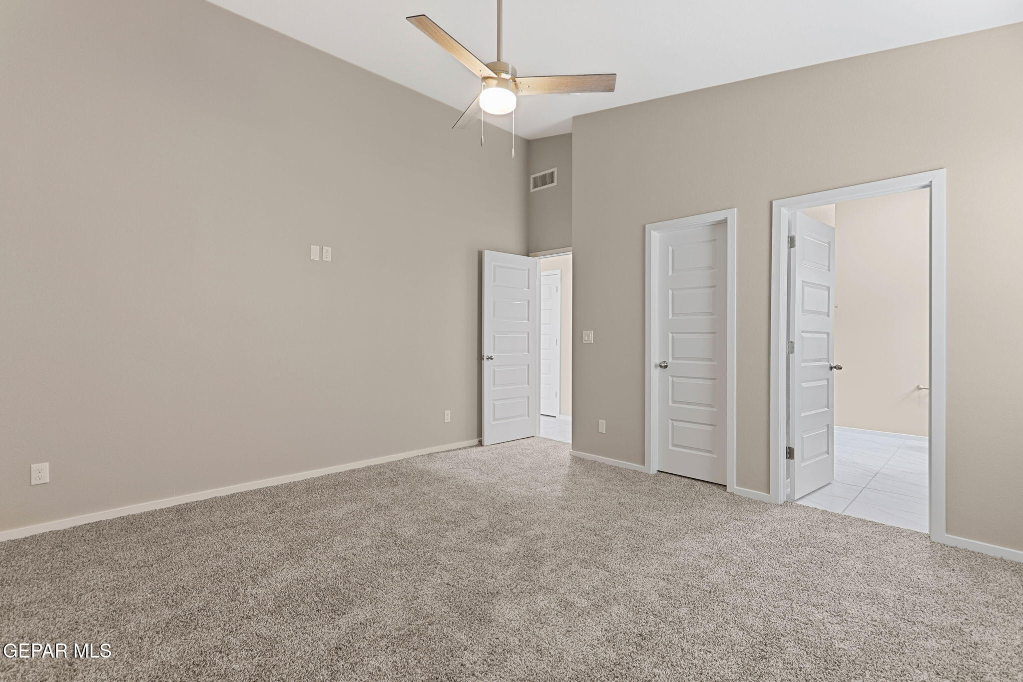 609 Espa Court Vinton, TX 79821 - Photo 15 of 19 an empty room with closet and a ceiling fan