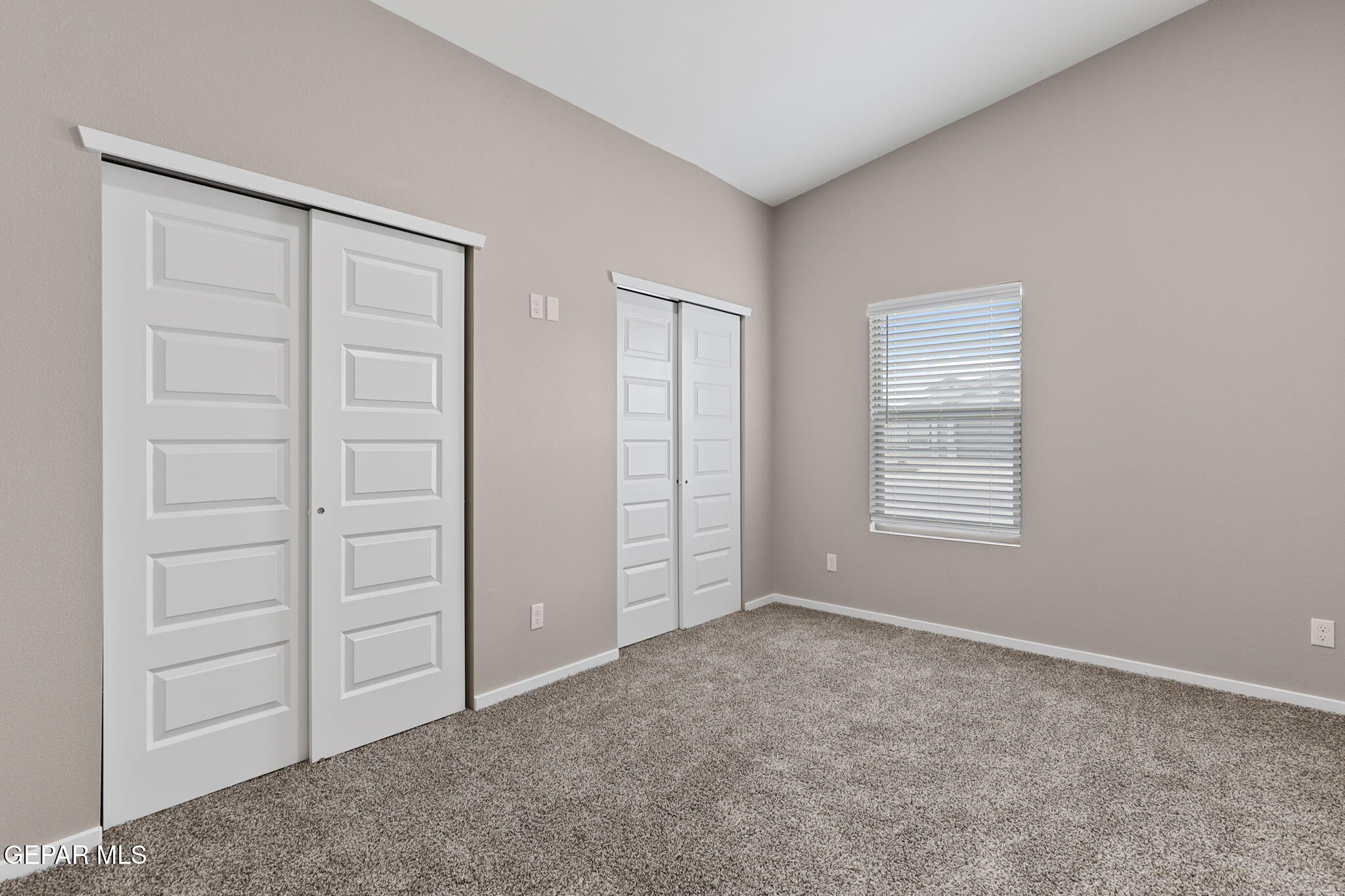 609 Espa Court Vinton, TX 79821 - Photo 18 of 19 an empty room with windows and closet