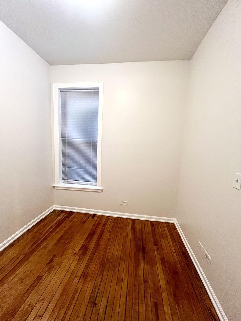 3227 South Carpenter Street, Unit 1M Chicago, IL 60608 - Photo 11 of 14 a view of a room with wooden floor and small space