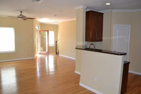 a view of an entryway with wooden floor