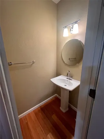 a bathroom with a sink a mirror and vanity