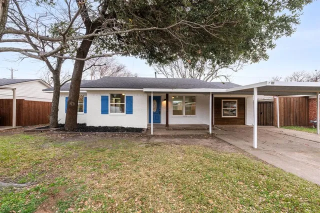 a house with trees in the background