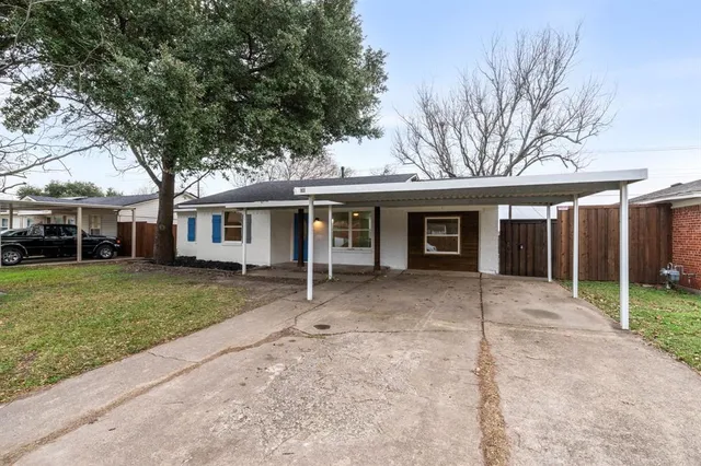 front view of a house with a garden