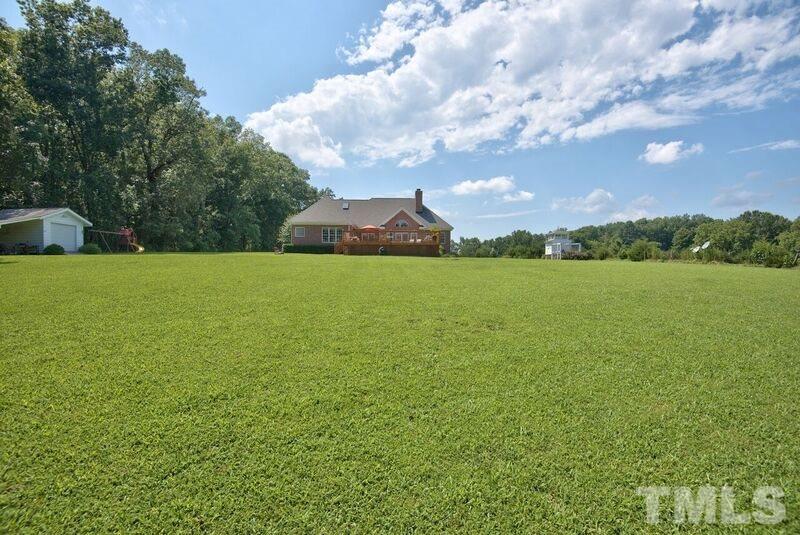 8306 Ball Road Bahama, NC 27503 - Photo 20 of 21 2.25 private acre lot with play area, chicken coop, huge deck, pool and wooded backdrop!