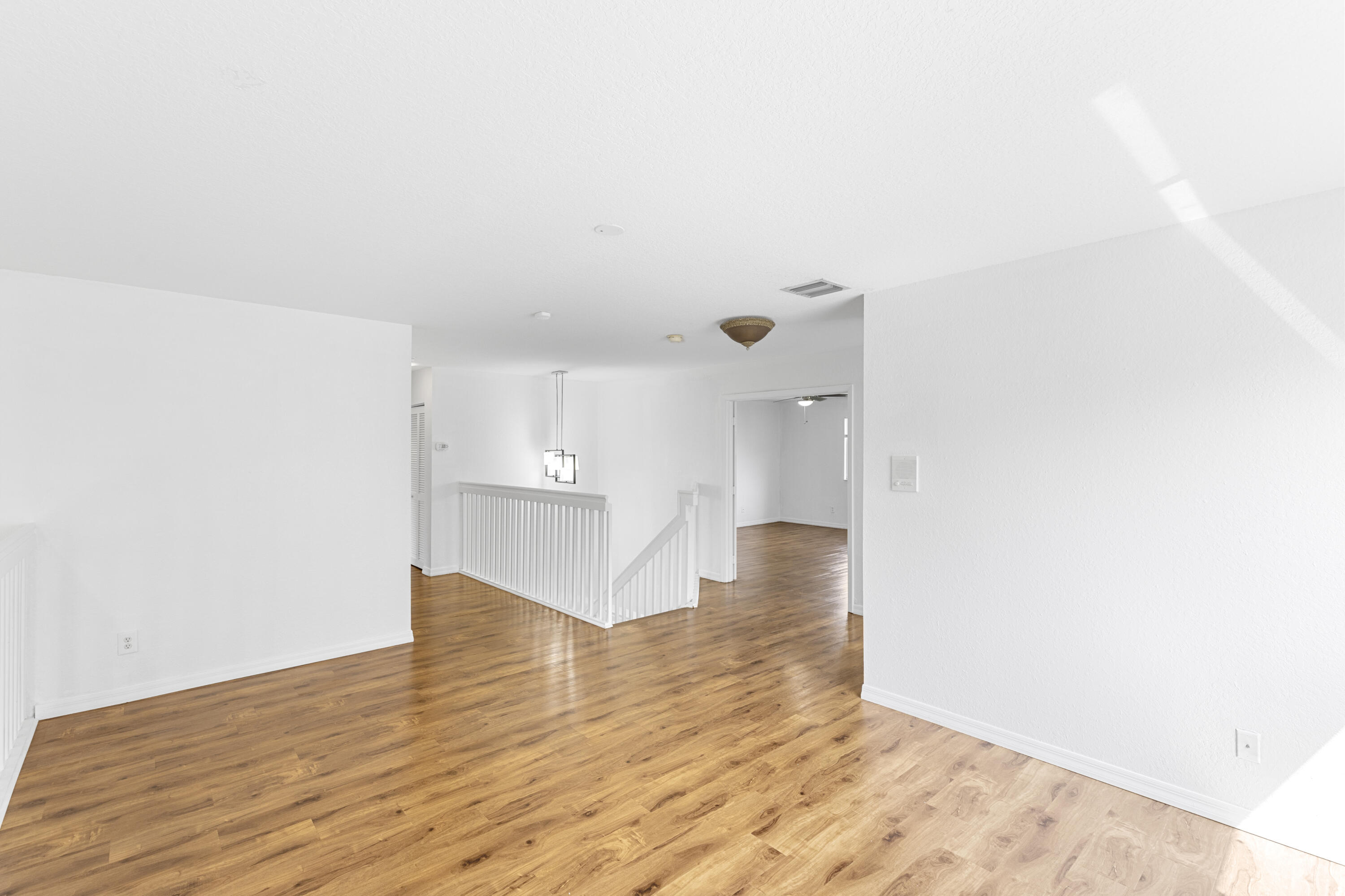 19389 Southwest 64th Street Pembroke Pines, FL 33332 - Photo 18 of 61 a view of empty room with wooden floor