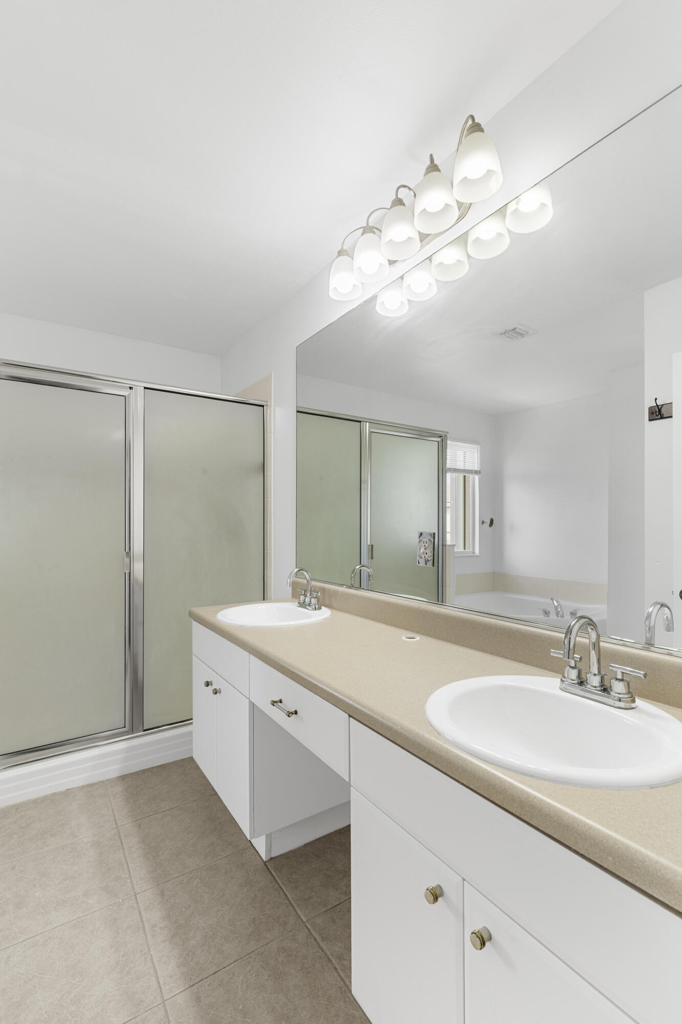 19389 Southwest 64th Street Pembroke Pines, FL 33332 - Photo 22 of 61 a bathroom with a sink a mirror and a shower
