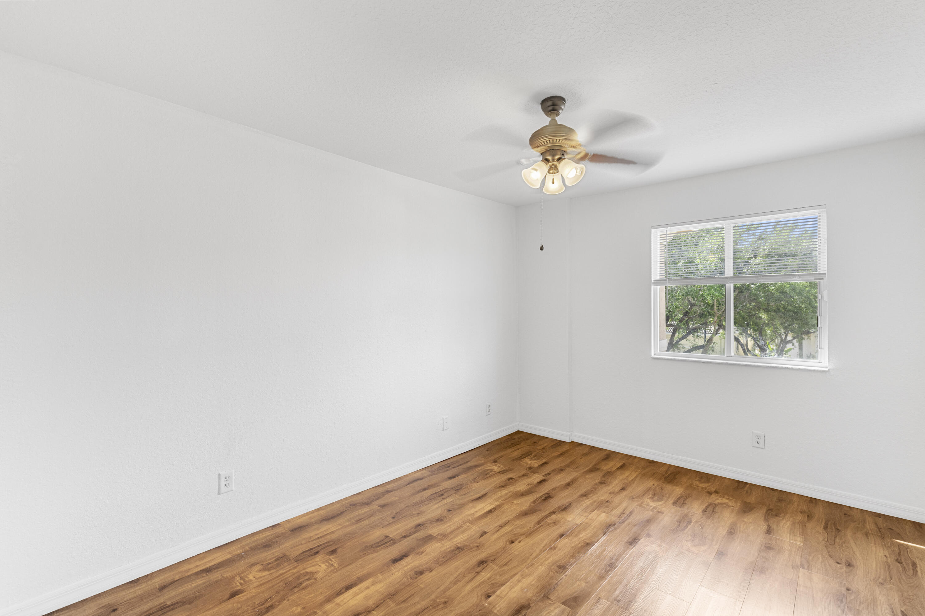 19389 Southwest 64th Street Pembroke Pines, FL 33332 - Photo 27 of 61 an empty room with a window and a fan