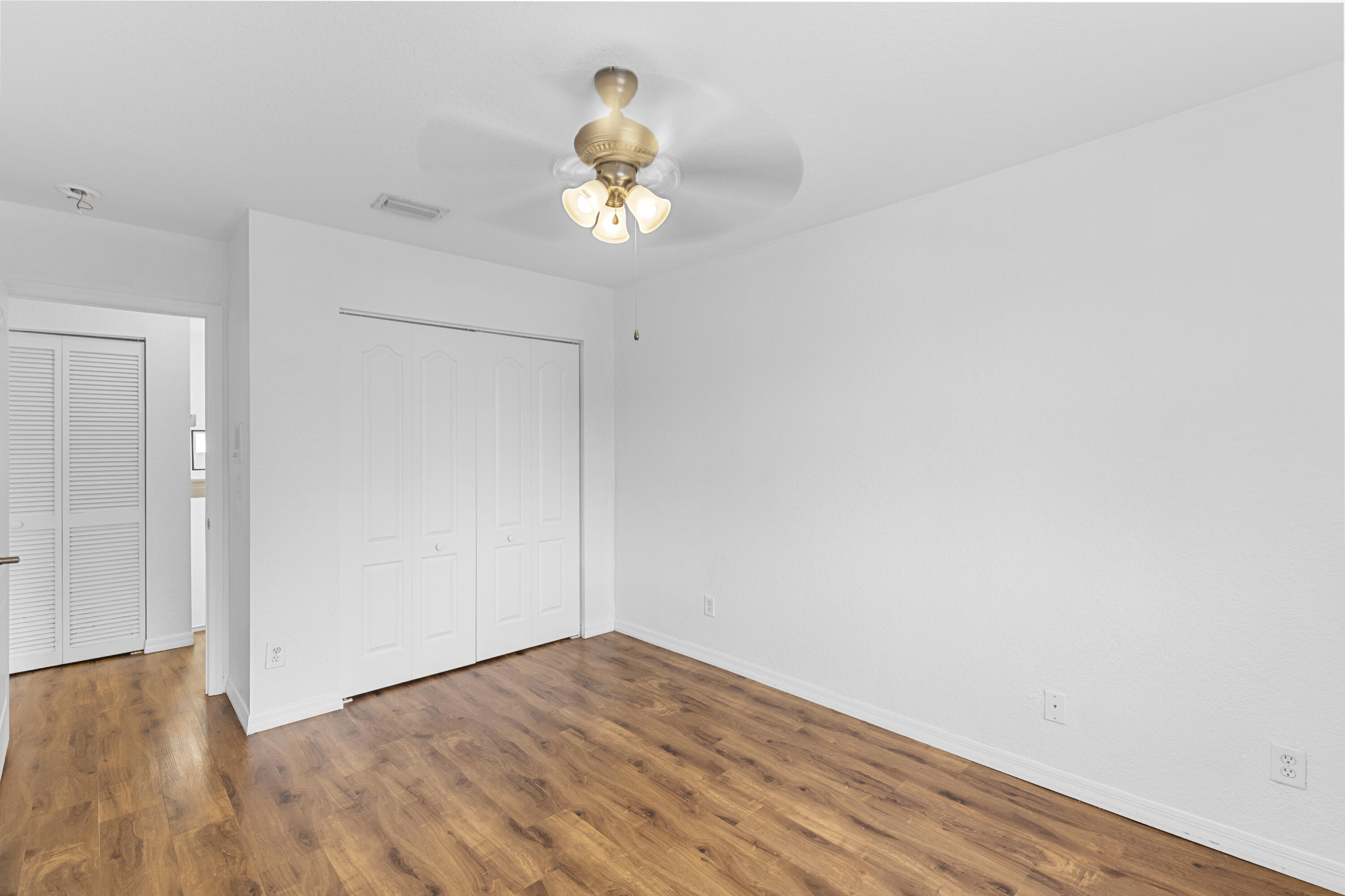 19389 Southwest 64th Street Pembroke Pines, FL 33332 - Photo 28 of 61 a view of an empty room with wooden floor