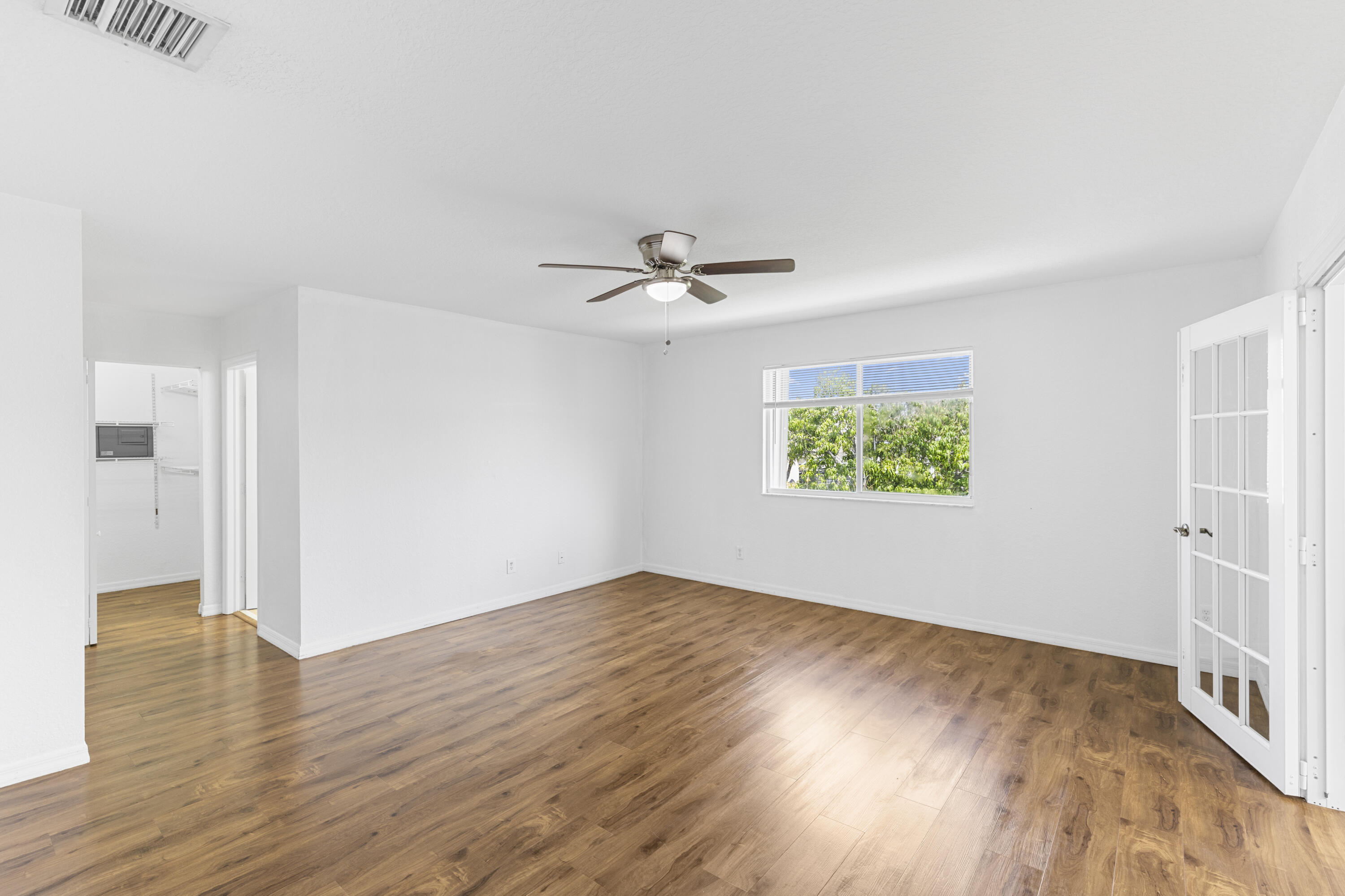 19389 Southwest 64th Street Pembroke Pines, FL 33332 - Photo 31 of 61 wooden floor in an empty room with a window