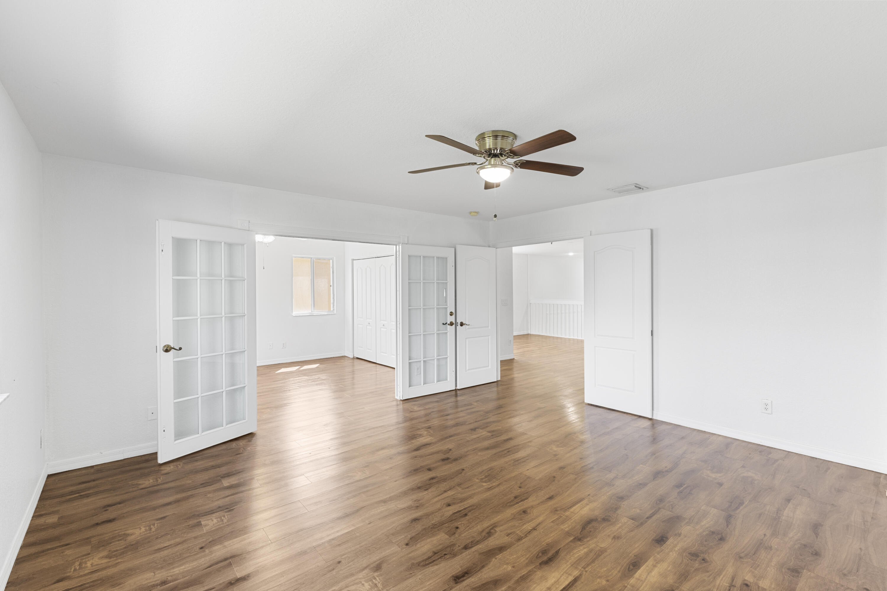 19389 Southwest 64th Street Pembroke Pines, FL 33332 - Photo 32 of 61 a view of an empty room with wooden floor and a window