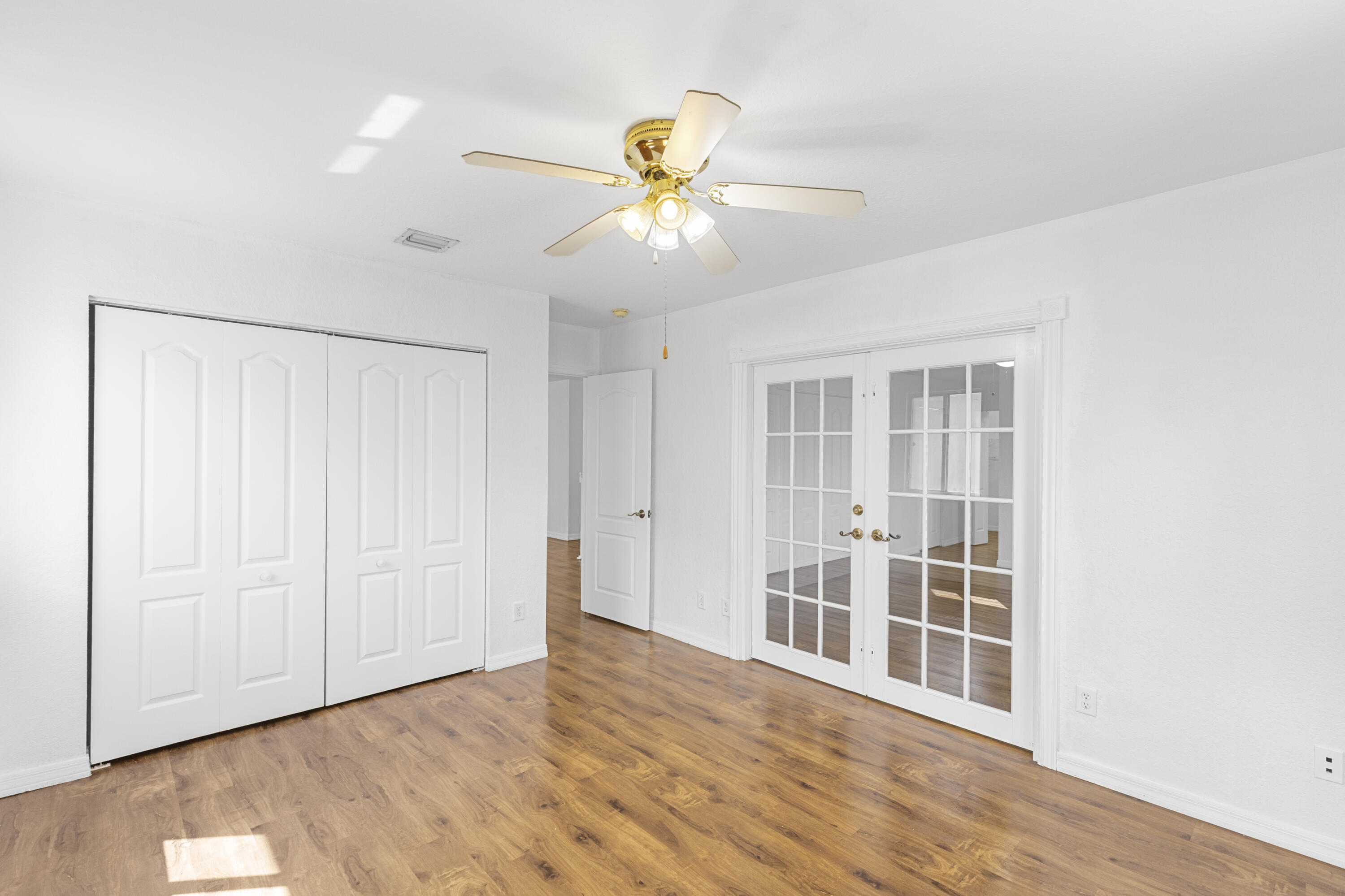 19389 Southwest 64th Street Pembroke Pines, FL 33332 - Photo 34 of 61 wooden floor in an empty room with a window