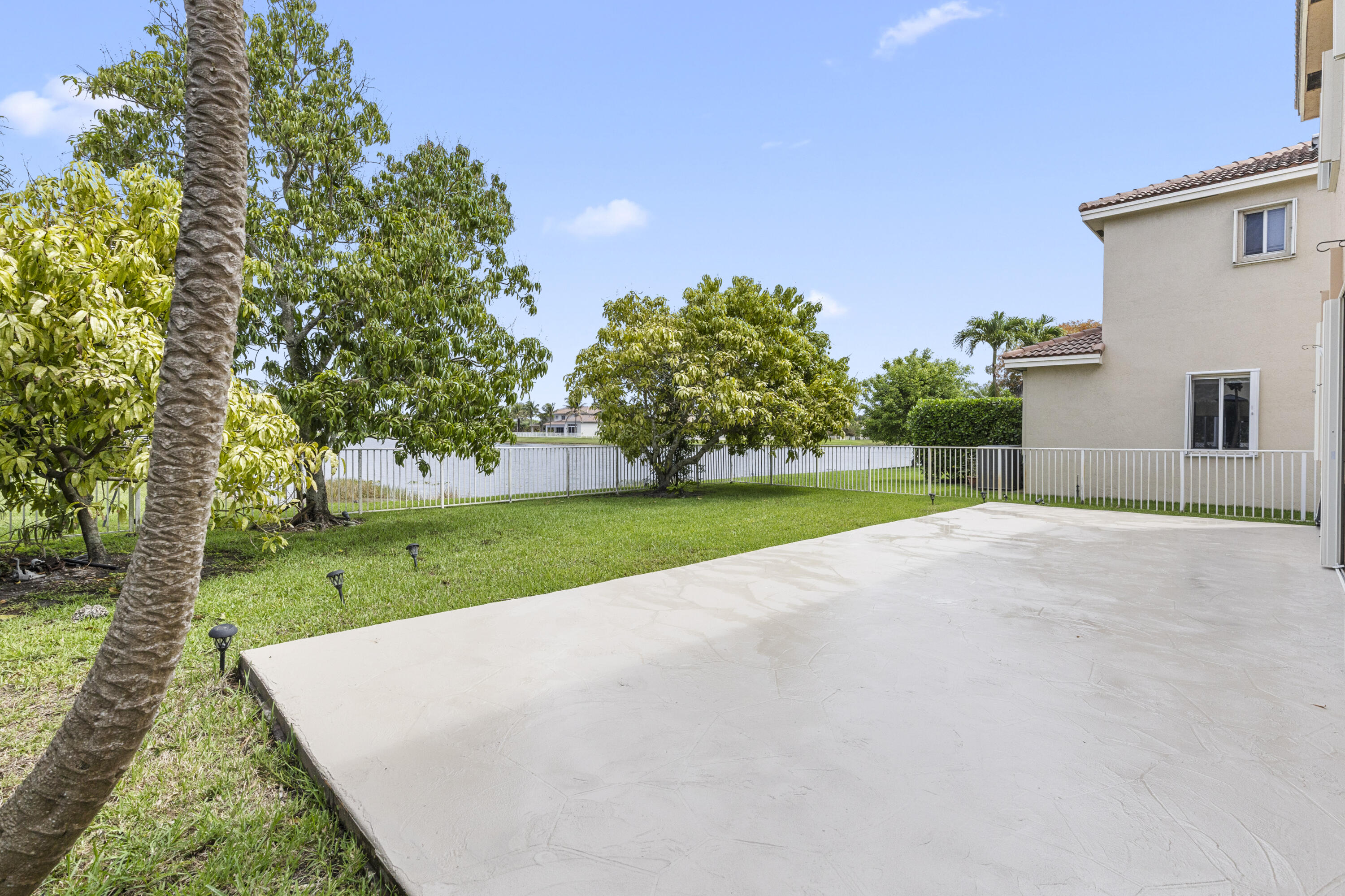 19389 Southwest 64th Street Pembroke Pines, FL 33332 - Photo 39 of 61 a view of a house with a big yard and large trees