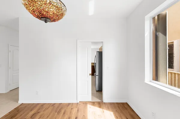 a kitchen with stainless steel appliances granite countertop a stove a refrigerator and a sink