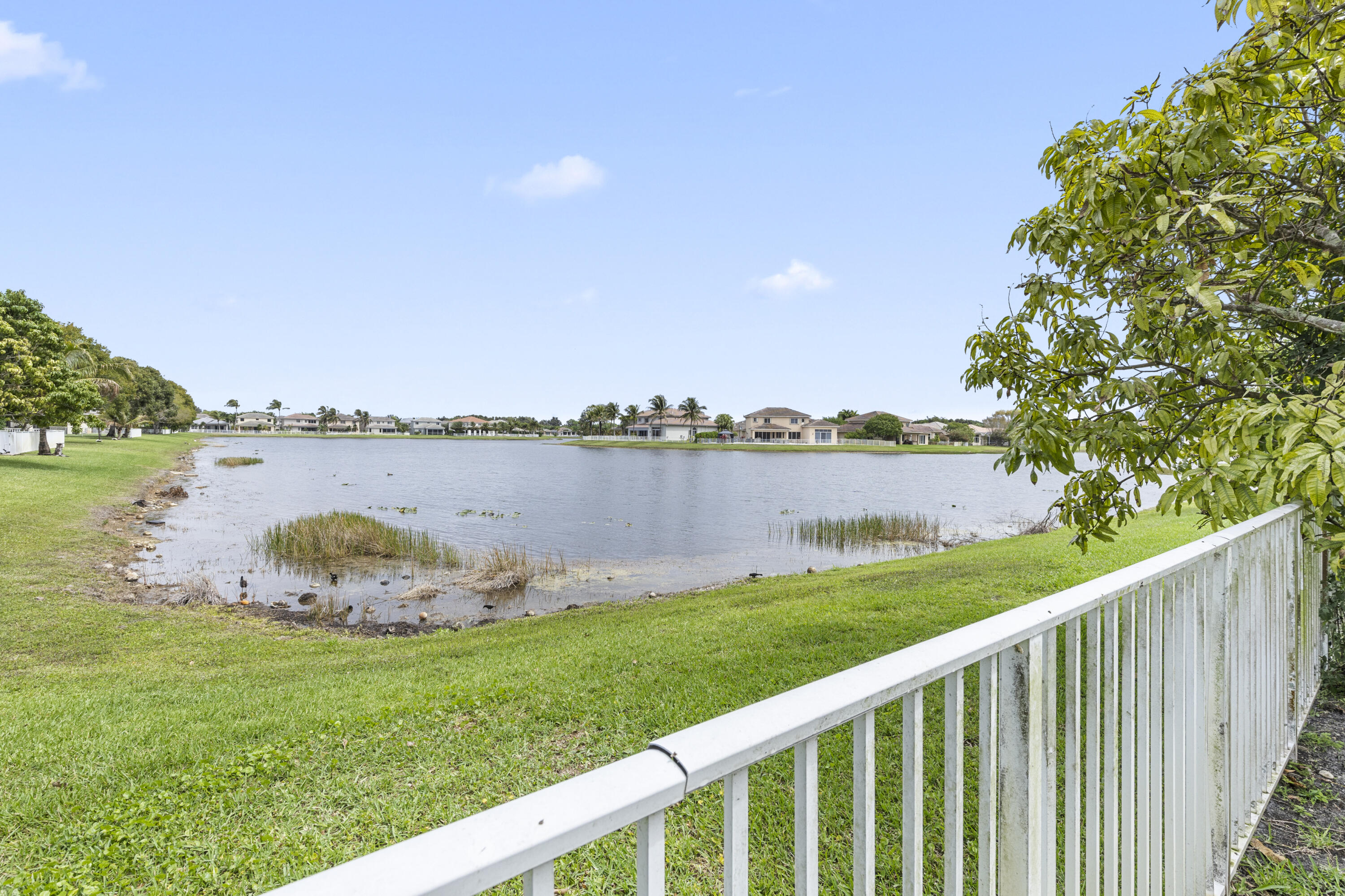 19389 Southwest 64th Street Pembroke Pines, FL 33332 - Photo 41 of 61 a yard with wooden fence and lake view