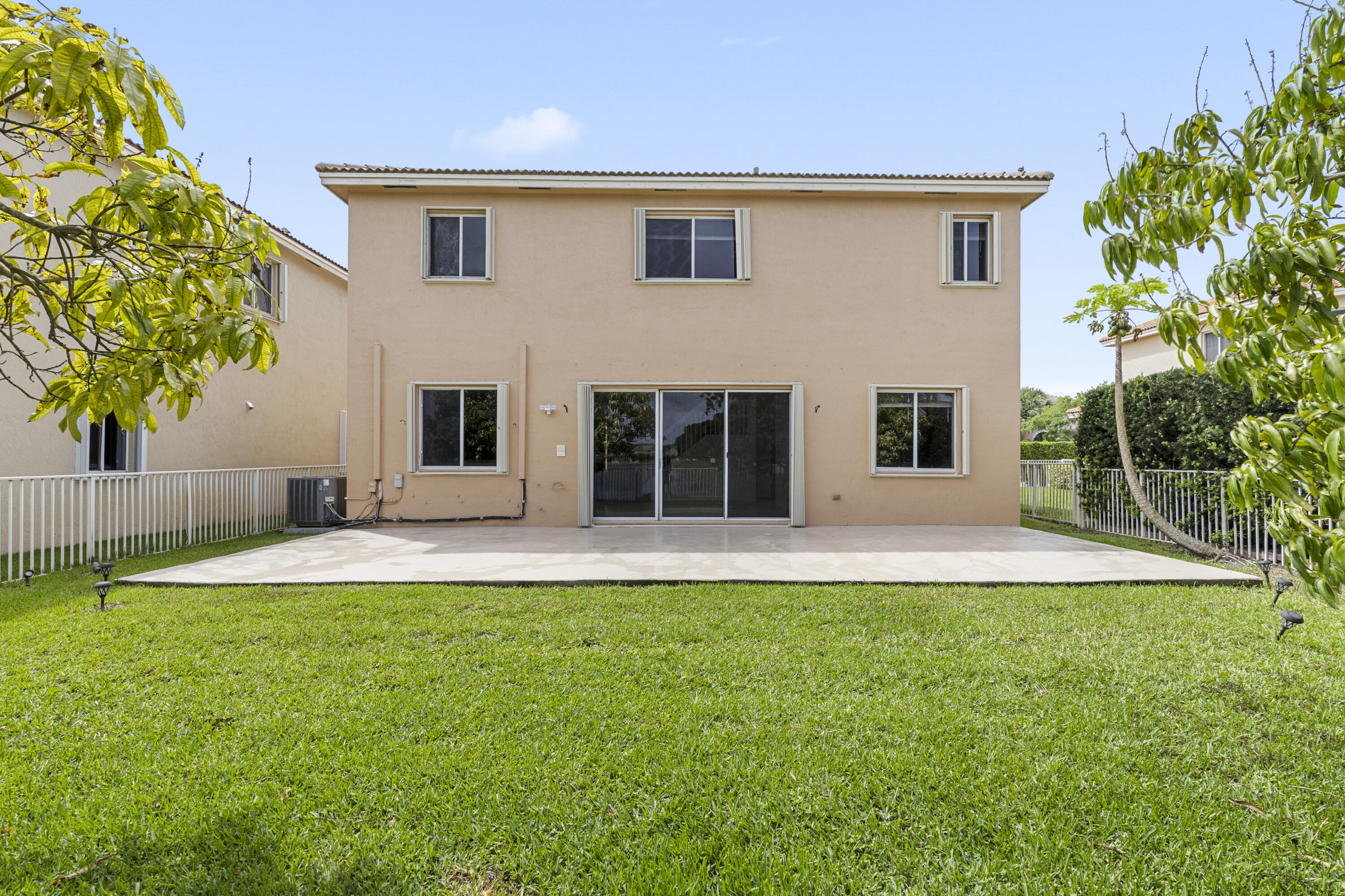 19389 Southwest 64th Street Pembroke Pines, FL 33332 - Photo 42 of 61 a house that has a big yard in front of it