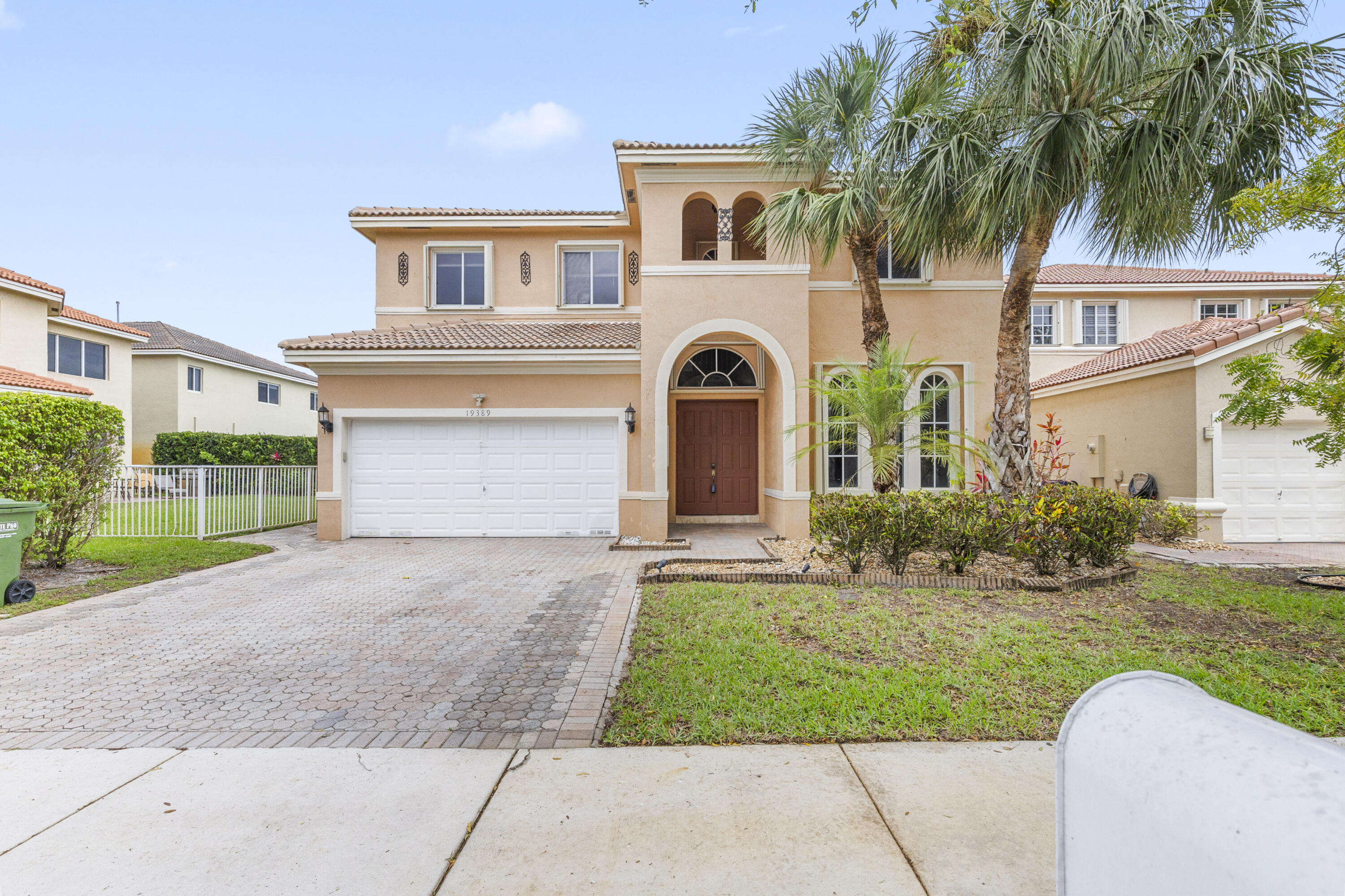 19389 Southwest 64th Street Pembroke Pines, FL 33332 - Photo 44 of 61 front view of a house with a yard