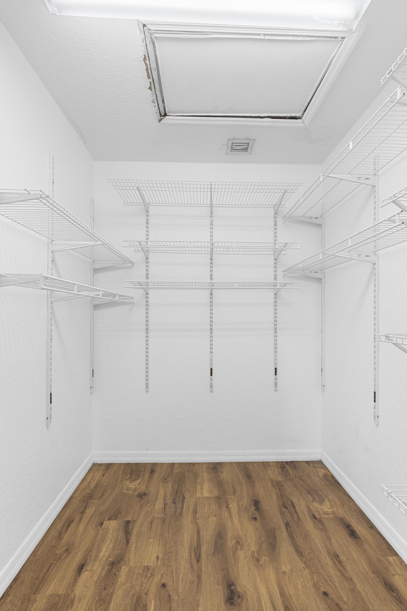 19389 Southwest 64th Street Pembroke Pines, FL 33332 - Photo 49 of 61 a view of a room with racks on the wall