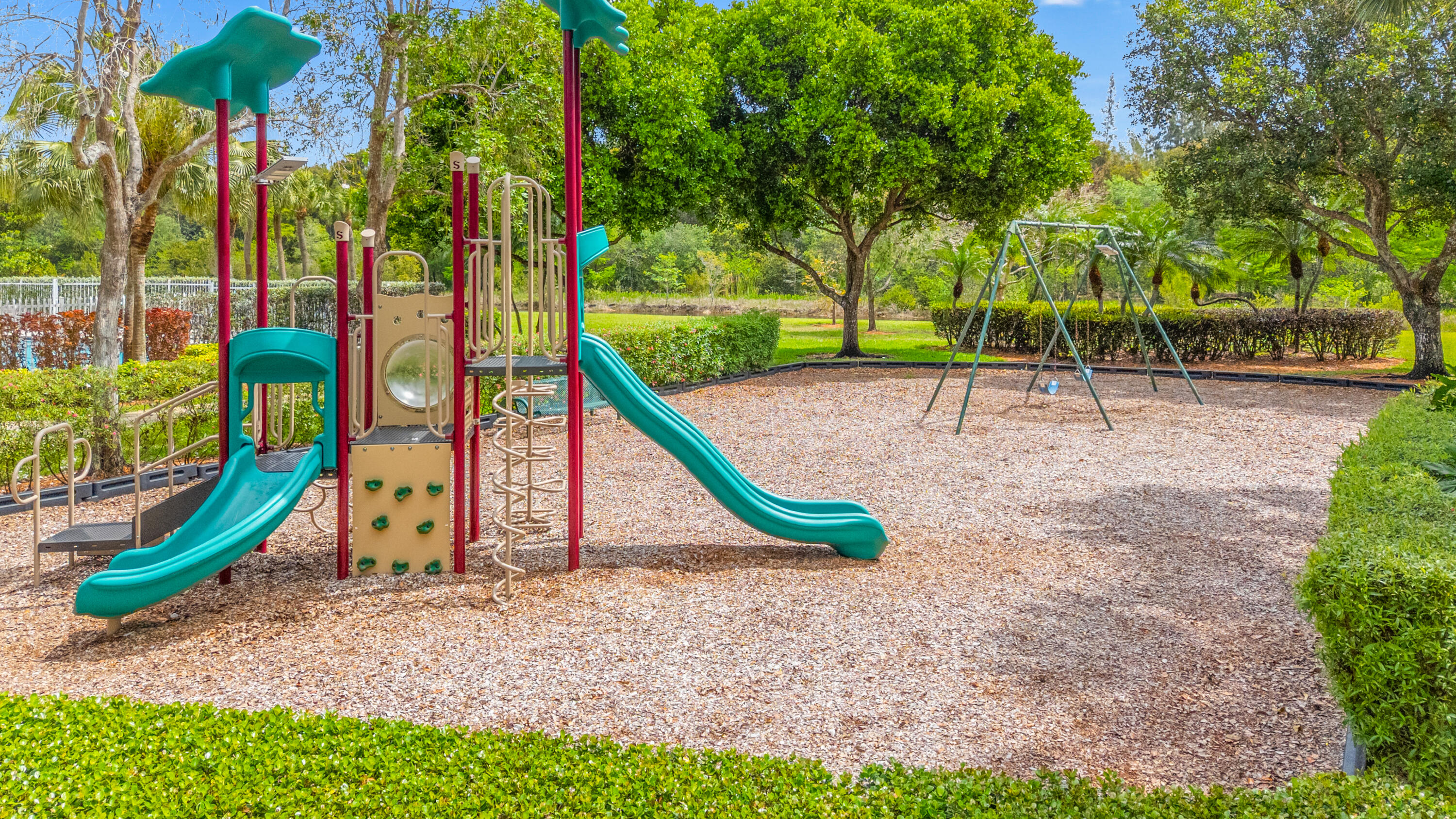 19389 Southwest 64th Street Pembroke Pines, FL 33332 - Photo 53 of 61 a view of a park with swings