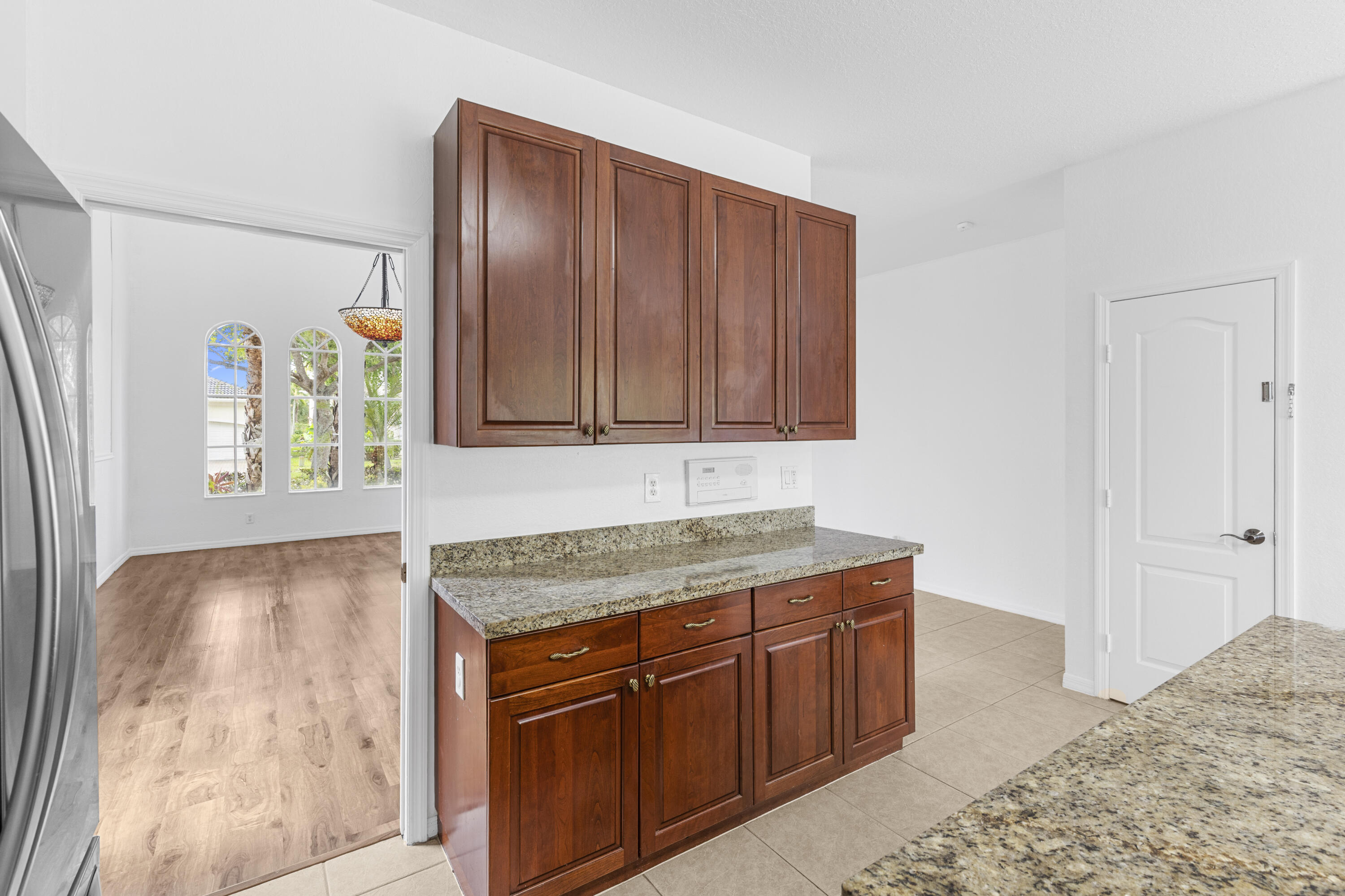19389 Southwest 64th Street Pembroke Pines, FL 33332 - Photo 9 of 61 a kitchen with stainless steel appliances granite countertop cabinets and window