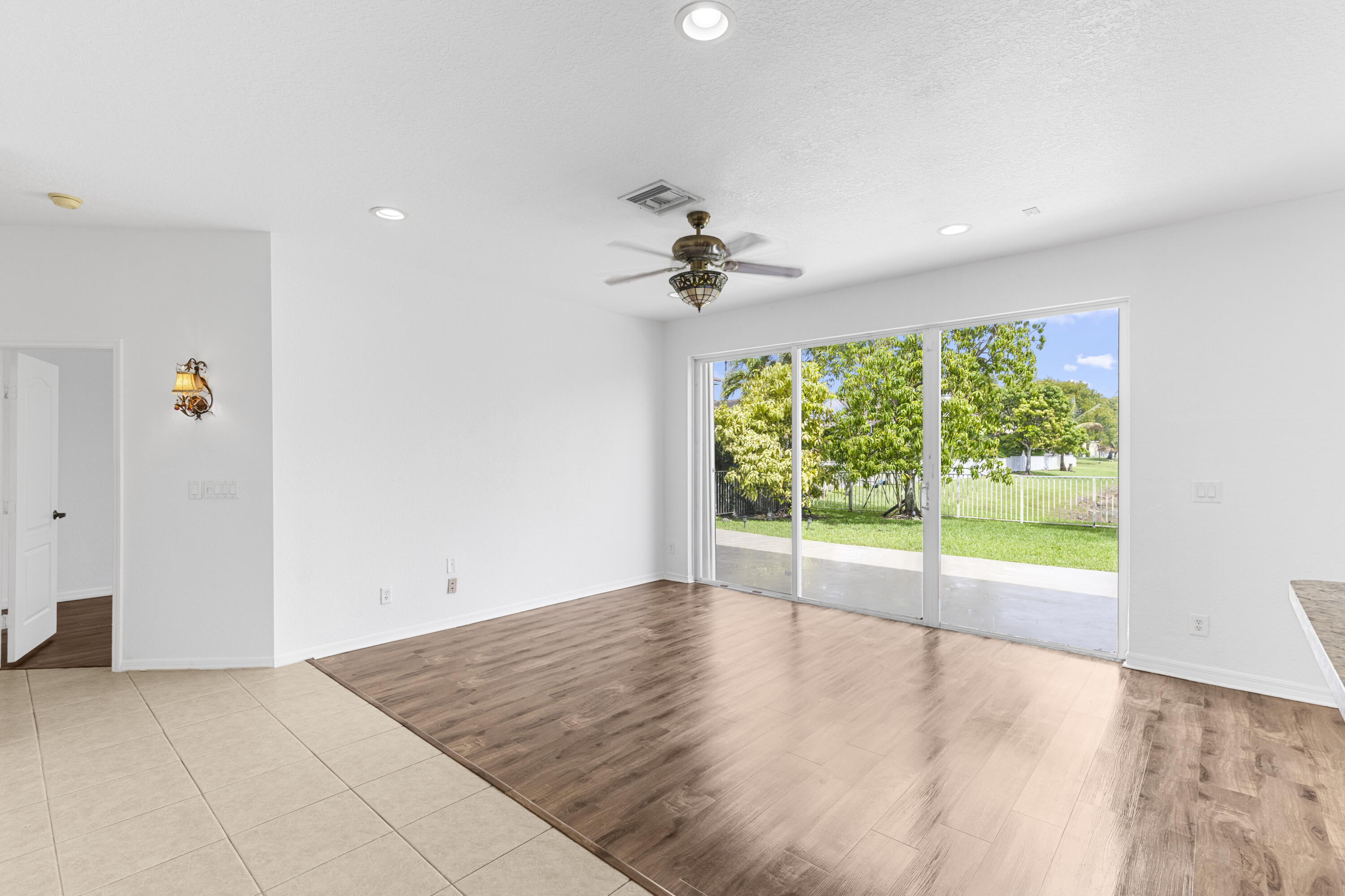 19389 Southwest 64th Street Pembroke Pines, FL 33332 - Photo 10 of 61 wooden floor in an empty room with a window