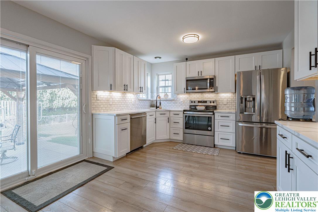 2389 Juniper Drive Coplay, PA 18037 - Photo 12 of 46 a kitchen with granite countertop white cabinets and stainless steel appliances