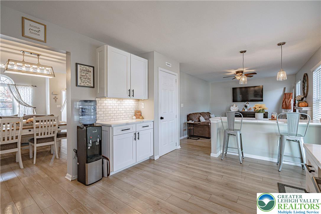 2389 Juniper Drive Coplay, PA 18037 - Photo 13 of 46 a large kitchen with cabinets wooden floor and stainless steel appliances