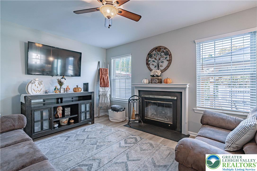 2389 Juniper Drive Coplay, PA 18037 - Photo 16 of 46 a living room with furniture a window and a fireplace