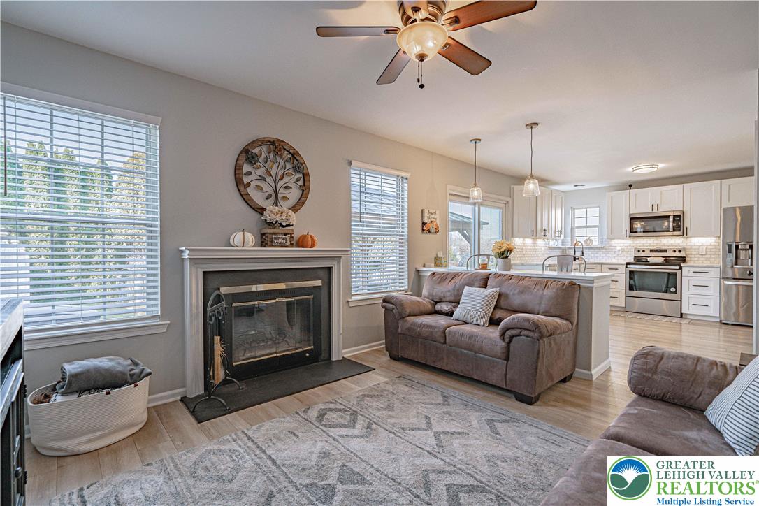 2389 Juniper Drive Coplay, PA 18037 - Photo 18 of 46 a living room with furniture a fireplace and window