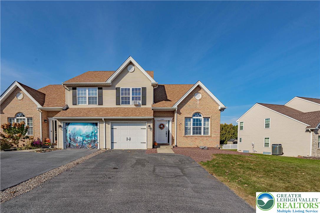 2389 Juniper Drive Coplay, PA 18037 - Photo 2 of 46 a view of a big house with a big yard and large trees