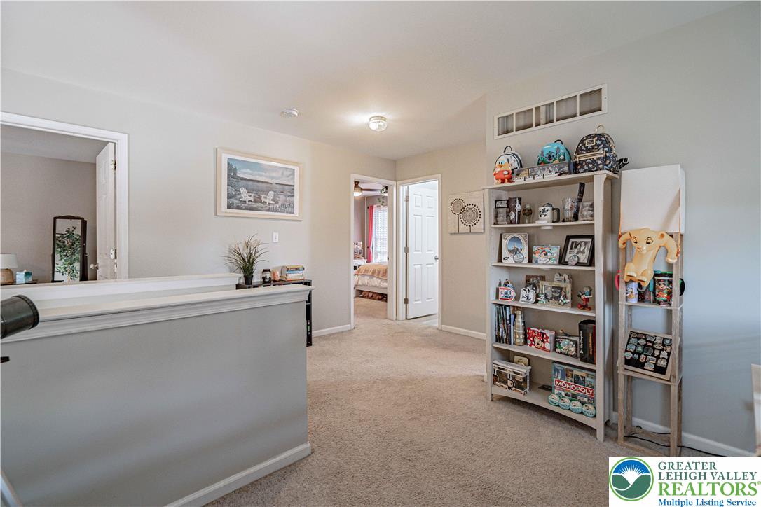 2389 Juniper Drive Coplay, PA 18037 - Photo 23 of 46 a living room with furniture and a book shelf