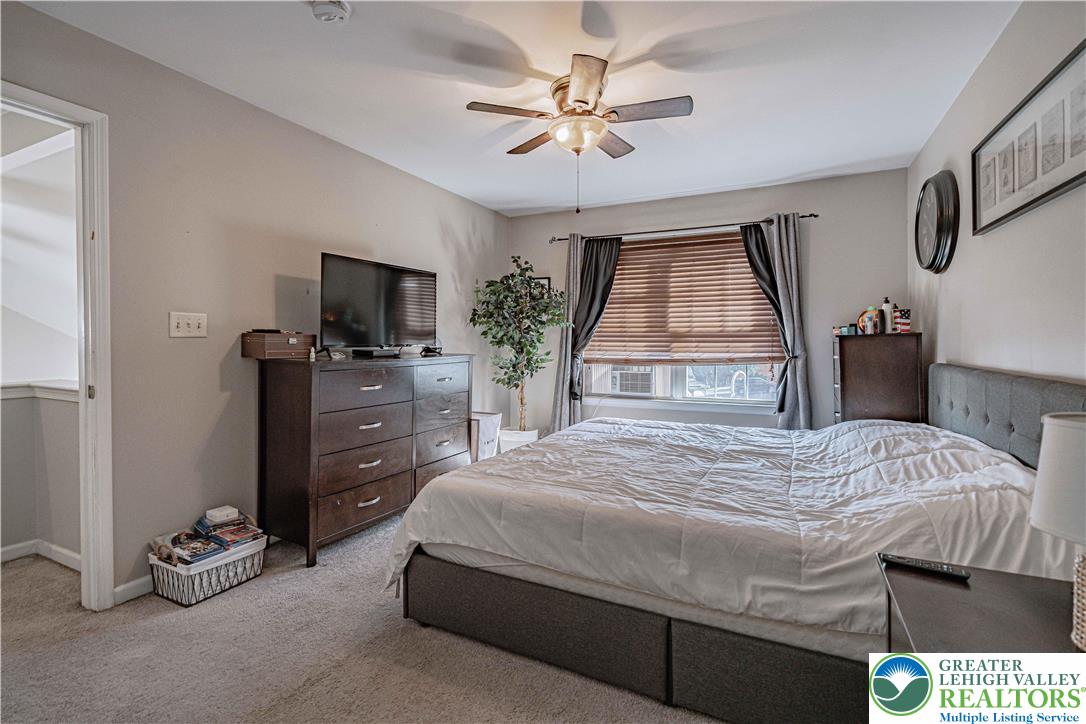 2389 Juniper Drive Coplay, PA 18037 - Photo 25 of 46 a bedroom with a bed and a flat tv screen on dresser