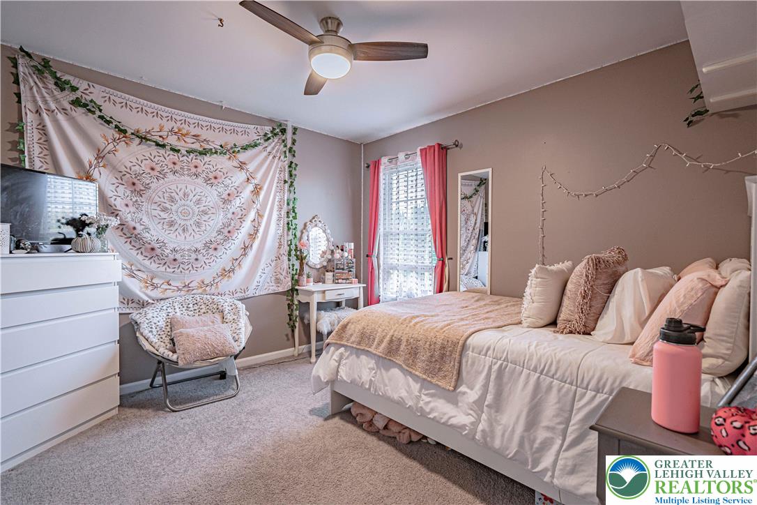 2389 Juniper Drive Coplay, PA 18037 - Photo 28 of 46 a bedroom with a bed and a couch