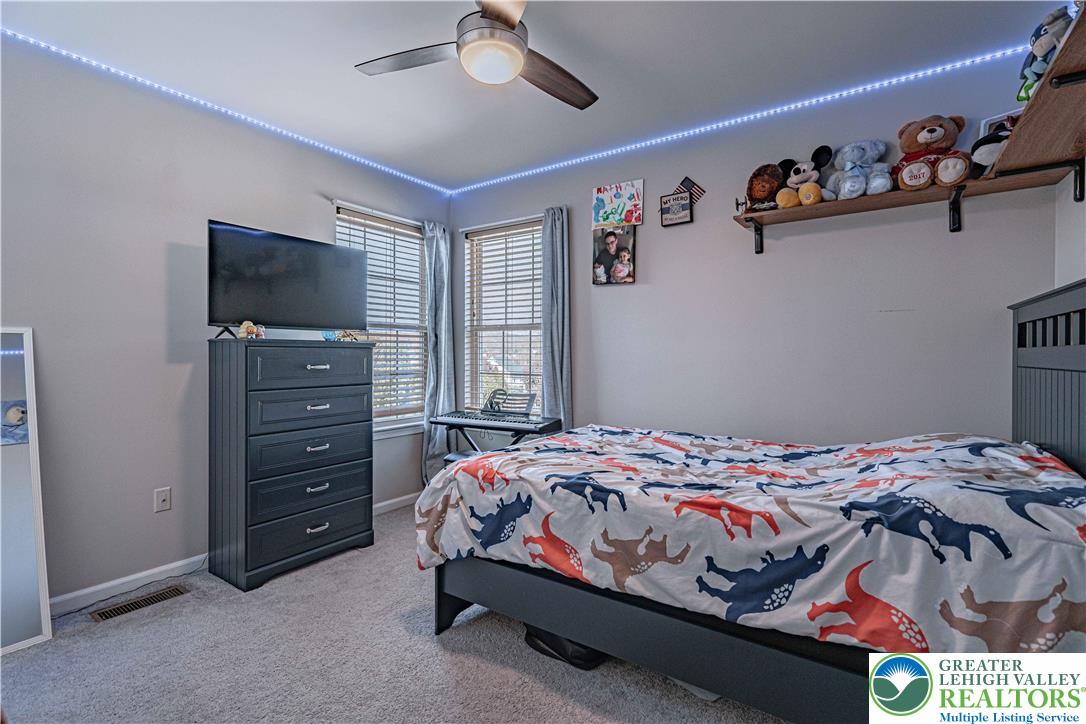 2389 Juniper Drive Coplay, PA 18037 - Photo 31 of 46 a bedroom with a bed and a television