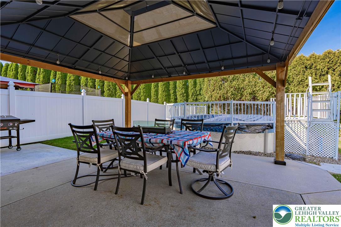 2389 Juniper Drive Coplay, PA 18037 - Photo 42 of 46 a view of an outdoor dining space with furniture and umbrella