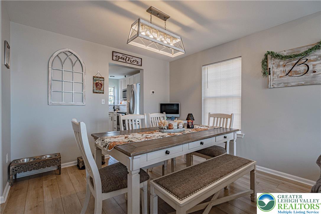 2389 Juniper Drive Coplay, PA 18037 - Photo 8 of 46 a view of a dining room with furniture and wooden floor