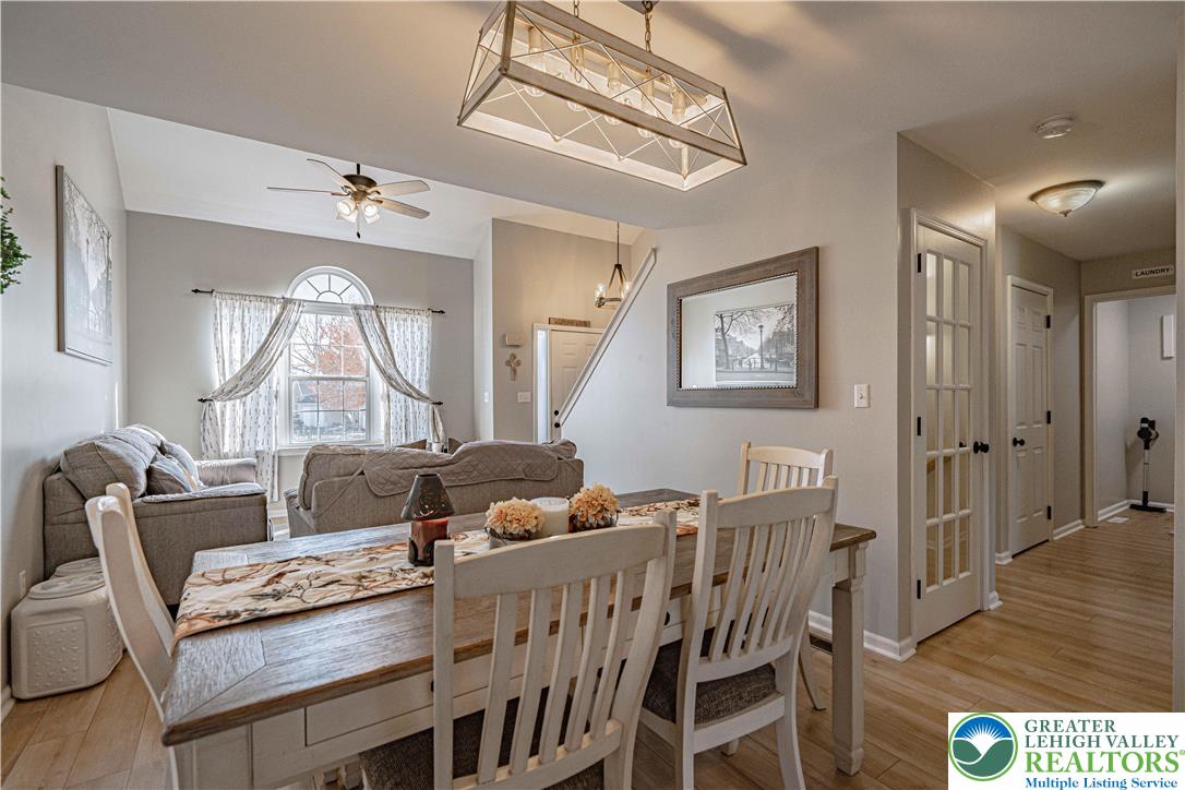 2389 Juniper Drive Coplay, PA 18037 - Photo 10 of 46 a living room with furniture a wooden floor and a chandelier