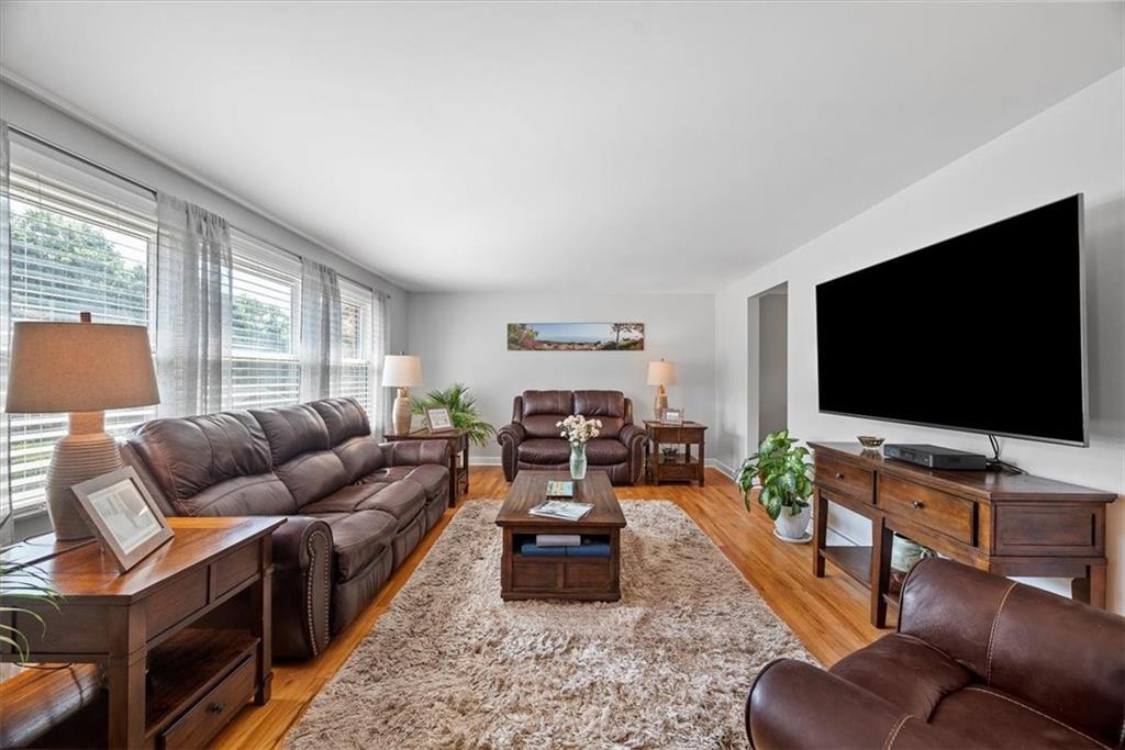 505 Hudderford Road Pittsburgh, PA 15237 - Photo 12 of 43 a living room with furniture and a flat screen tv