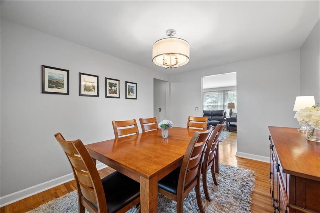 505 Hudderford Road Pittsburgh, PA 15237 - Photo 16 of 43 a view of a dining room with furniture and wooden floor