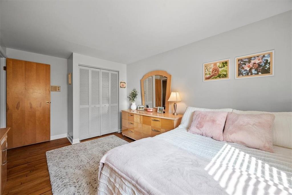 505 Hudderford Road Pittsburgh, PA 15237 - Photo 25 of 43 a bedroom with a bed and wooden floor