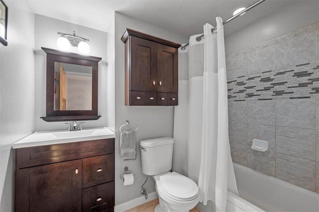 505 Hudderford Road Pittsburgh, PA 15237 - Photo 28 of 43 a bathroom with a toilet a sink a mirror a shower and vanity