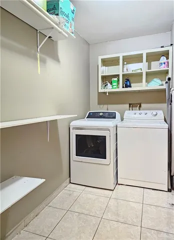 a utility room with washer and dryer