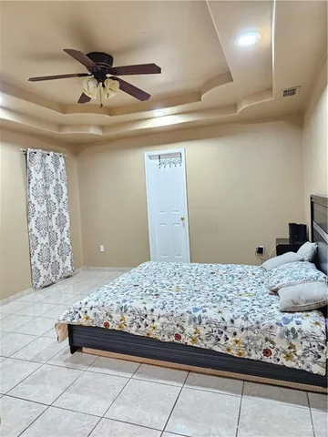 a bedroom with a bed and cabinets