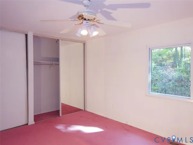 a bedroom with a bed and a lamp