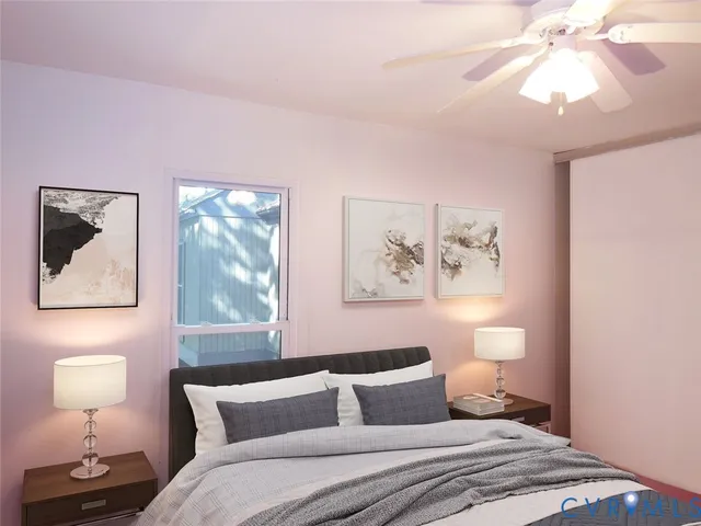 an empty room with a window and a chandelier fan