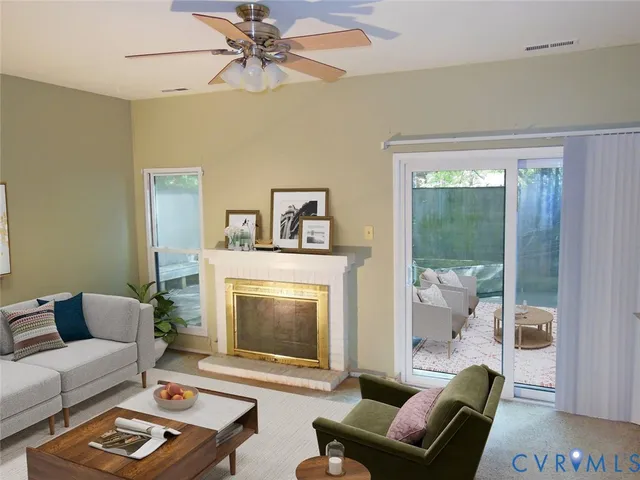 a view of an empty room with a fireplace and a window
